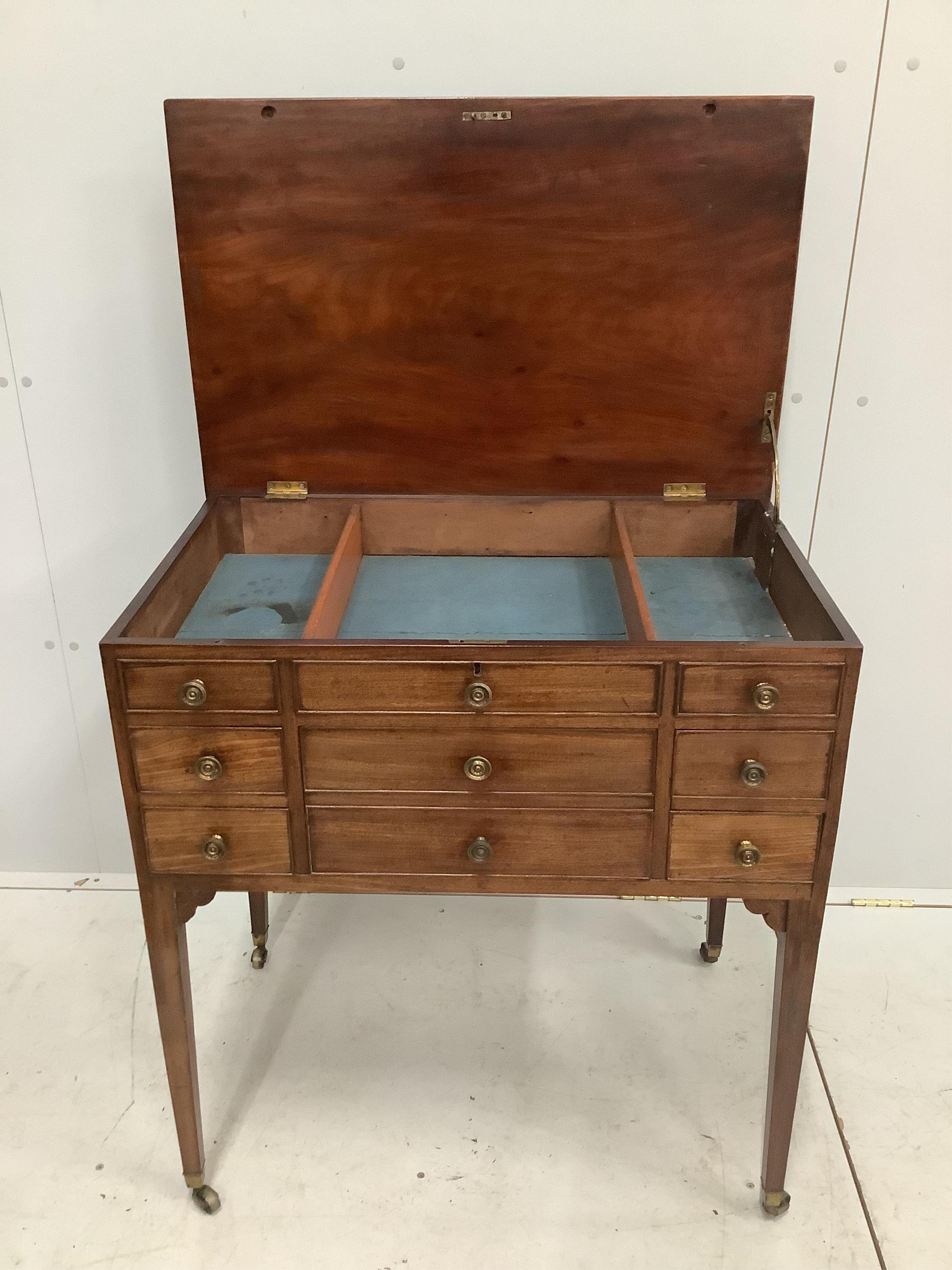 A late George III mahogany enclosed dressing table, with a lift up top, over drawers, width 78cm, depth 50cm, height 83cm. Condition - fair